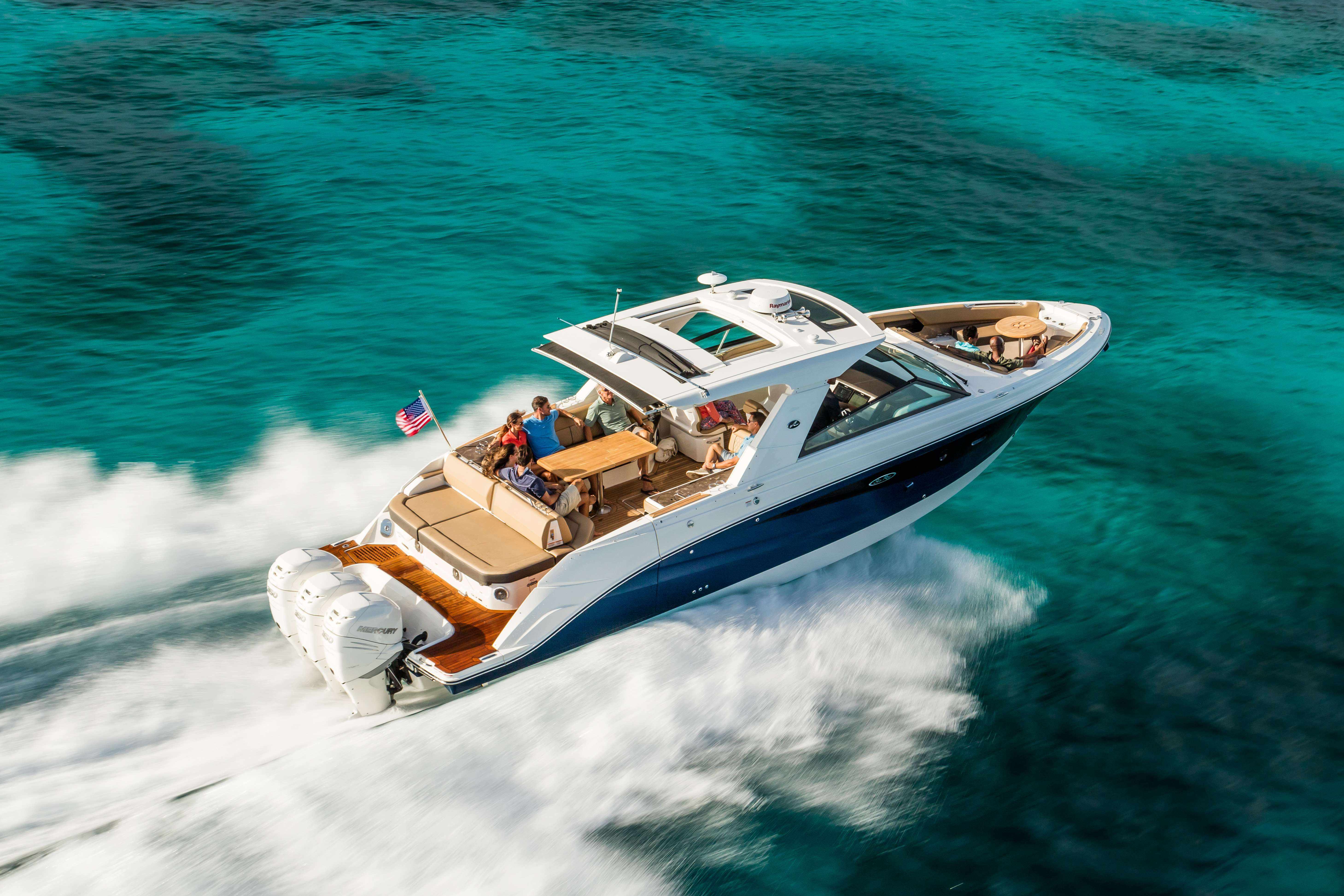 A leisure motorboat with open seating areas on the water